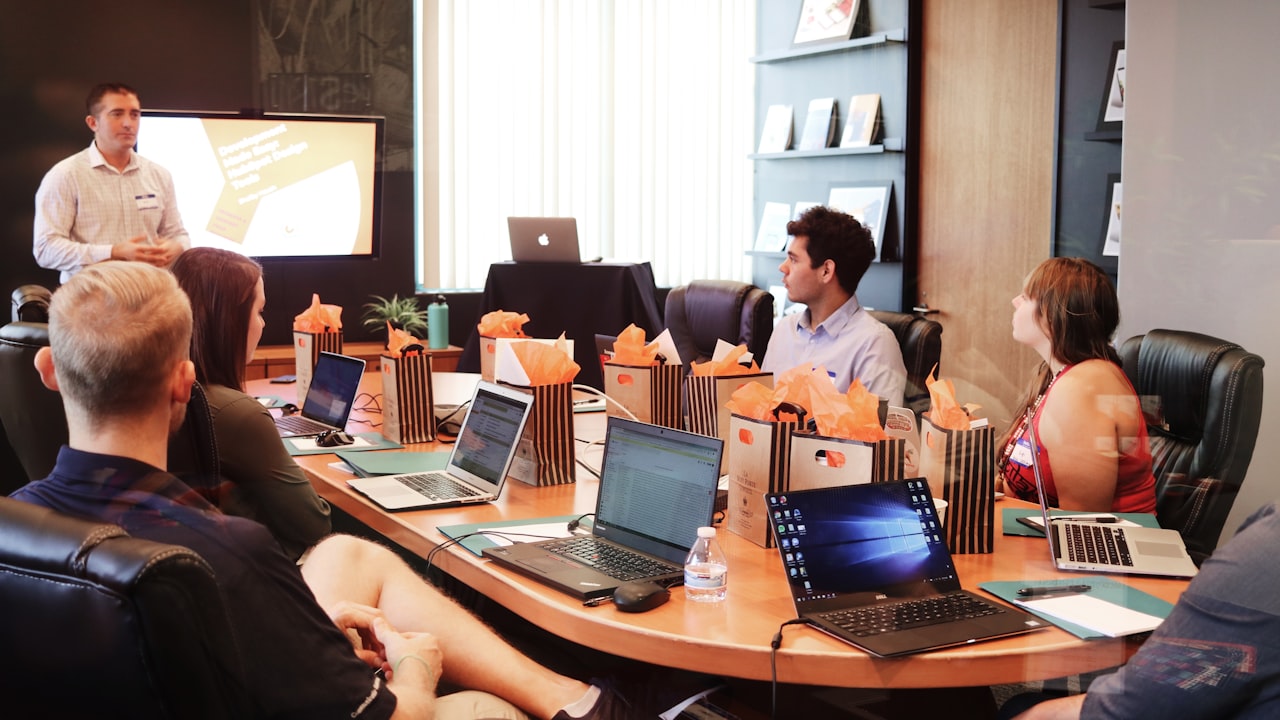Corporate training session with laptops and attendees